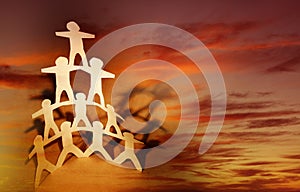 Paper chain team and sky