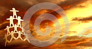 Paper chain team and sky