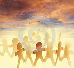 Paper chain team and sky