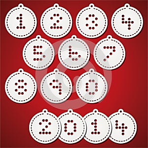 Paper christmas balls with puched numbers