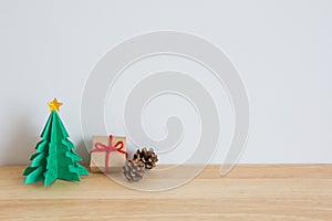 Paper christmas tree with present and pines