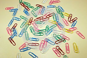 Paper clip, a lot of colored objects from above