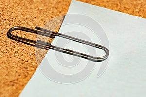 Paper with a clip on a note board is macro