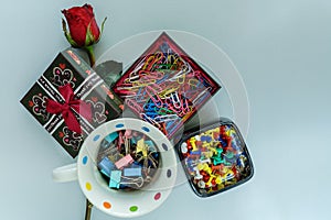 Paper clip, pin and rose