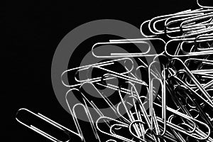 Paper clips closeup stationery on black clolor background