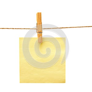 Paper with clothes peg over white