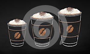 Paper coffee cups in three sizes with milk foam