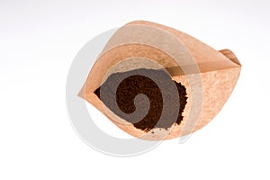 Paper coffee filter with ground coffee