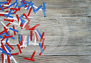 Paper confetti of national colors of France, Russia, USA, Serbia white-blue-red on a white wooden background, the concept of indep