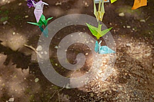 A paper crane swaying in the wind at the traditional street