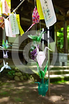 A paper crane swaying in the wind at the traditional street