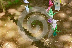 A paper crane swaying in the wind at the traditional street