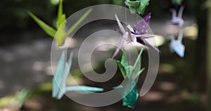 A paper crane swaying in the wind at the traditional street focusing