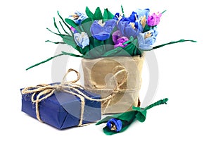 Paper crocuses and gift box in blue paper