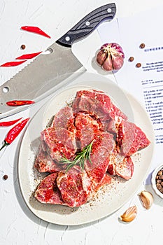 Paper culinary recipe for preparation pork. Raw ingredients includes pork loin pieces, spices, herbs