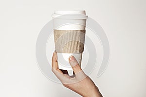 Paper cup of coffee on white background