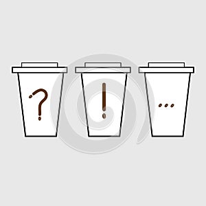 Three paper cups with punctuation marks: question mark, exclamation point and ellipsis photo