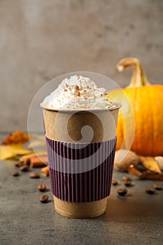 Paper cup with tasty pumpkin spice latte