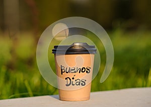 paper cup witn wrotten word on it