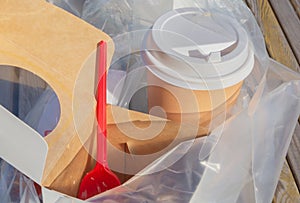 Paper cups for coffee, and packaging for food, plastic lids are assembled in one plastic bag