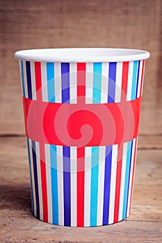 Paper cups on wooden surface