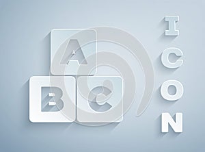 Paper cut ABC blocks icon isolated on grey background. Alphabet cubes with letters A,B,C. Paper art style. Vector