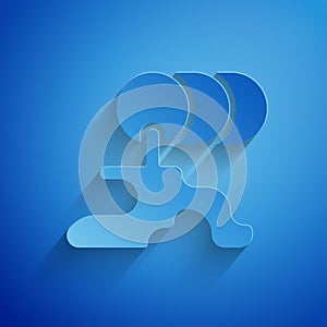 Paper cut Barrel oil leak icon isolated on blue background. Paper art style. Vector