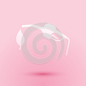 Paper cut Bio fuel concept with fueling nozzle and leaf icon isolated on pink background. Natural energy concept. Gas