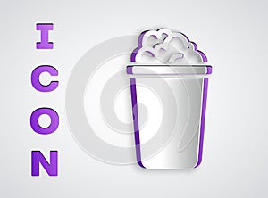 Paper cut Bucket with soap suds icon isolated on grey background. Bowl with water. Washing clothes, cleaning equipment