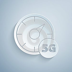 Paper cut Digital speed meter concept with 5G icon isolated on grey background. Global network high speed connection