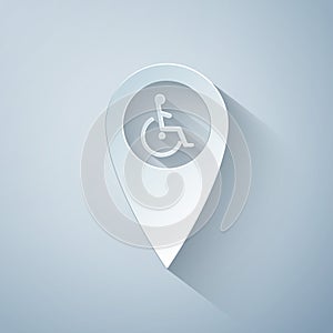 Paper cut Disabled Handicap in map pointer icon isolated on grey background. Invalid symbol. Wheelchair handicap sign