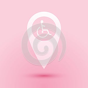 Paper cut Disabled Handicap in map pointer icon isolated on pink background. Invalid symbol. Wheelchair handicap sign
