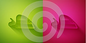 Paper cut Electric iron icon isolated on green and pink background. Steam iron. Paper art style. Vector