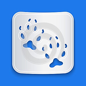 Paper cut Fox paw footprint icon isolated on blue background. Paper art style. Vector