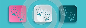 Paper cut Fox paw footprint icon isolated on blue background. Paper art style. Vector