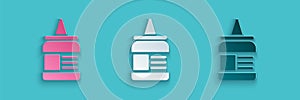 Paper cut Glue icon isolated on blue background. Paper art style. Vector Illustration