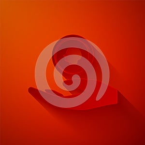 Paper cut Hand holding coin money icon isolated on red background. Dollar or USD symbol. Cash Banking currency sign