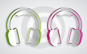 Paper cut Headphones icon isolated on grey background. Earphones. Concept for listening to music, service, communication