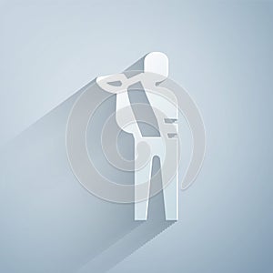 Paper cut Human broken arm icon isolated on grey background. Injured man in bandage. Paper art style. Vector