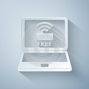 Paper cut Laptop and free wi-fi wireless connection icon isolated on grey background. Wireless technology, wi-fi