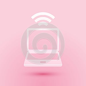 Paper cut Laptop and free wi-fi wireless connection icon isolated on pink background. Wireless technology, wi-fi