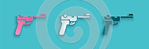 Paper cut Mauser gun icon isolated on blue background. Mauser C96 is a semi-automatic pistol. Paper art style. Vector