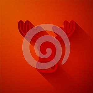Paper cut Moose head with horns icon isolated on red background. Paper art style. Vector