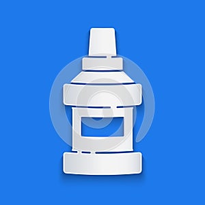 Paper cut Mouthwash plastic bottle icon isolated on blue background. Liquid for rinsing mouth. Oralcare equipment. Paper