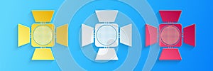 Paper cut Movie spotlight icon isolated on blue background. Light Effect. Scene, Studio, Show. Paper art style. Vector