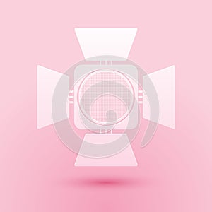 Paper cut Movie spotlight icon isolated on pink background. Light Effect. Scene, Studio, Show. Paper art style. Vector