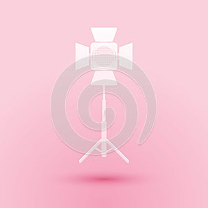 Paper cut Movie spotlight icon isolated on pink background. Light Effect. Scene, Studio, Show. Paper art style. Vector