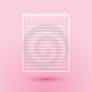 Paper cut Notebook icon isolated on pink background. Spiral notepad icon. School notebook. Writing pad. Diary for