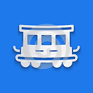 Paper cut Passenger train cars toy icon isolated on blue background. Railway carriage. Paper art style. Vector