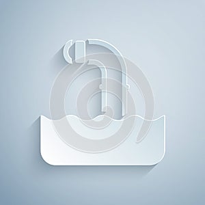 Paper cut Periscope in the waves above the water icon isolated on grey background. Paper art style. Vector